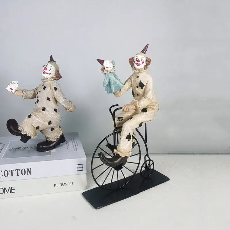 Cream-colored circus clown joker figurine with black polka dots riding vintage bicycle for living room decor