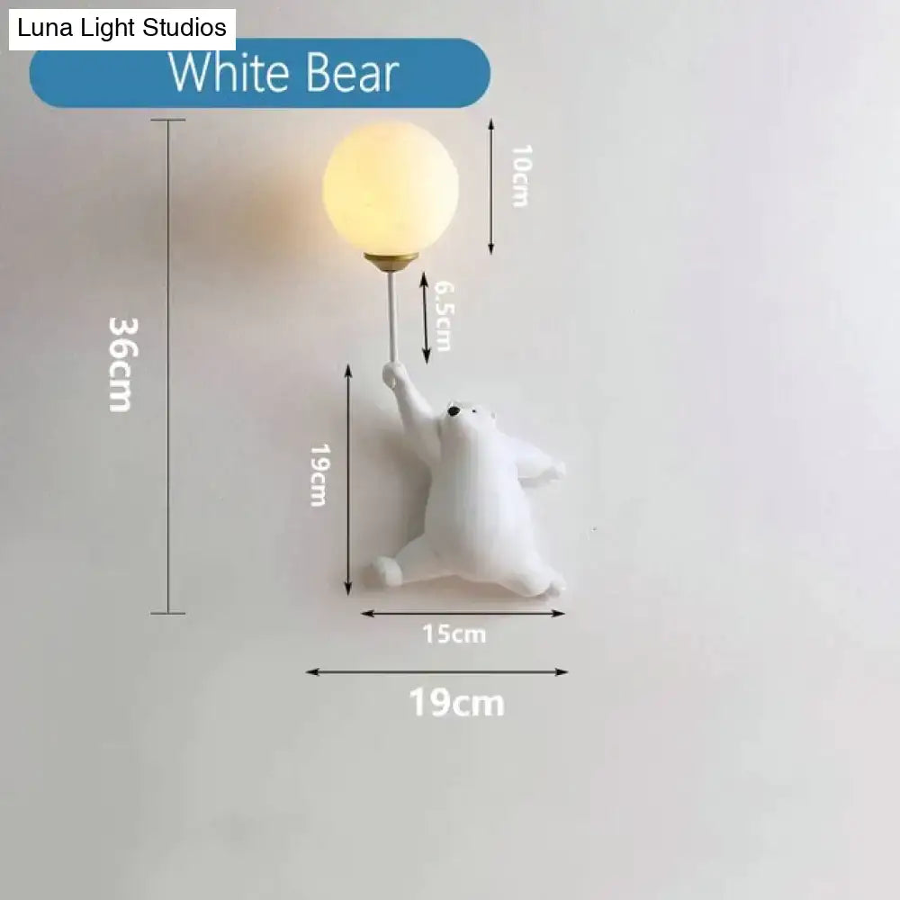 White polar bear girl wall lamp with spherical frosted glass bulb for whimsical pink polka dot bedroom decor