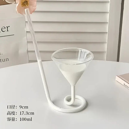 Whimsical pink vampire cocktail glass cup with a white glass cup straw and spiral base for dining room decor