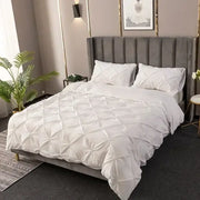 White 3d pinch pleat duvet cover set with diamond pattern featuring soft fabric and matching pillows for bedroom use