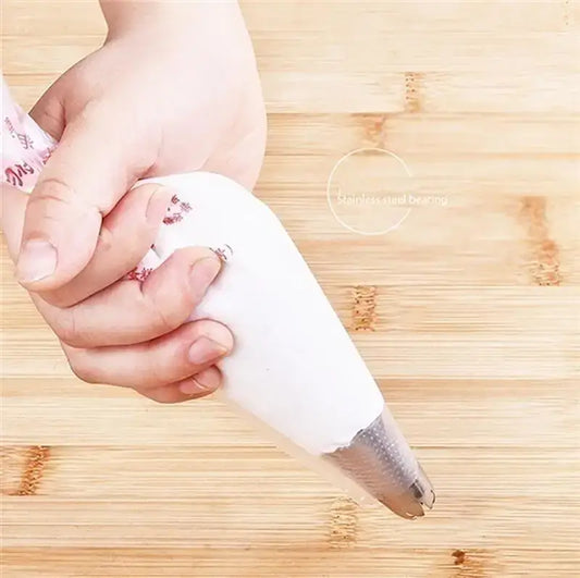White disposable pastry bag with stainless steel tip made of silicone for kitchen baking and decoration use