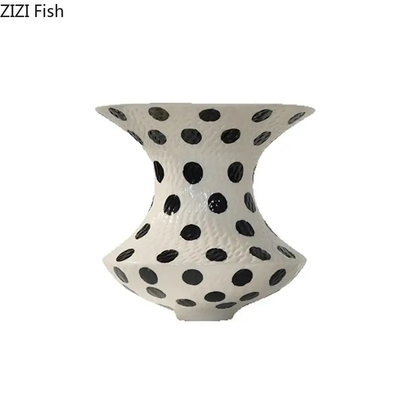 White and black ceramic vase with black polka dot pattern and textured flared design for living room decor