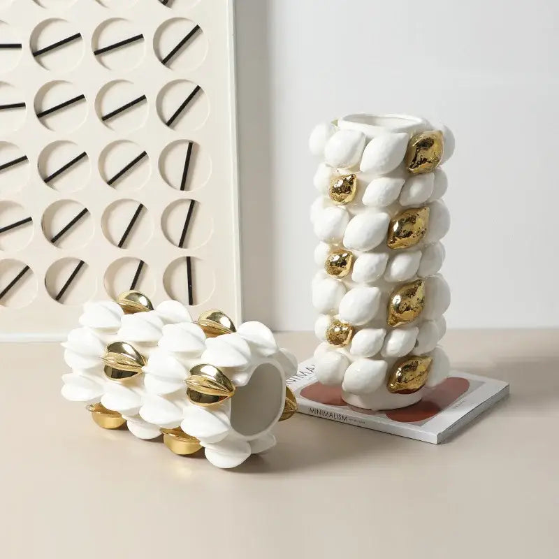 White and gold carambola ceramic vase featuring shell-like accents for elegant living room decor by decorbites lemon carambola