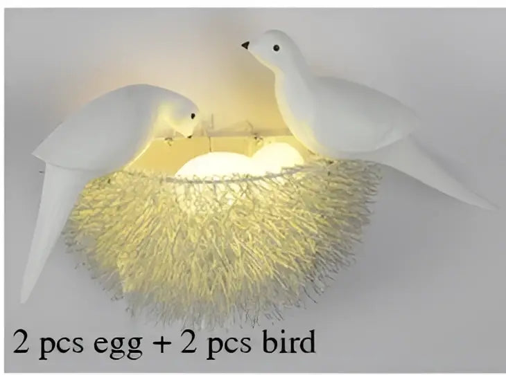 White and gold ceramic nest wall lamp featuring a bird design with golden fiber nest and glowing egg for children room