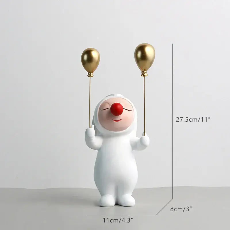 White and gold ceramic clown bust sculpture with red nose holding two gold balloons for kids room candy tray