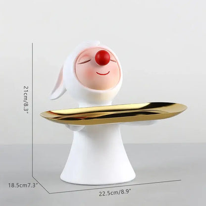 White and gold ceramic clown bust sculpture with red nose and closed eyes holding a candy tray for kids room