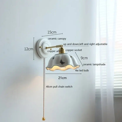 White and gold ceramic led wall light featuring a fluted butterfly lampshade and brass-finished copper arm decorbites ceramic led