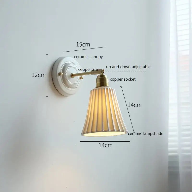 Vintage-style white and gold ceramic led wall light with brass arm and cream fluted shade decorbites ceramic led bedroom sconce