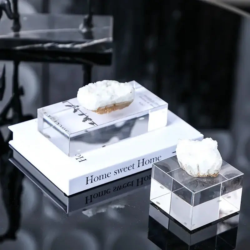 White and gold crystal coralline ornaments featuring white quartz crystal geodes on clear acrylic cube stands for living room decor