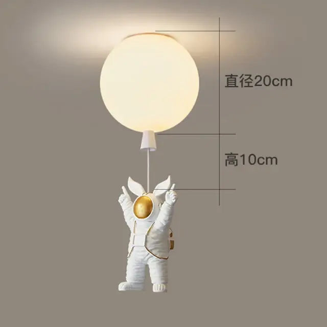White and gold decorbites astronaut space ball ceiling lamp with a white astronaut figurine holding a glowing sphere