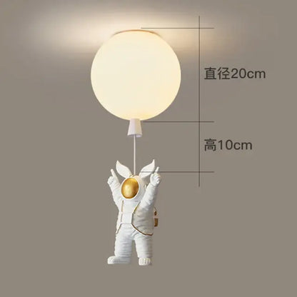 White and gold decorbites astronaut space ball ceiling lamp with a white astronaut figurine holding a glowing sphere