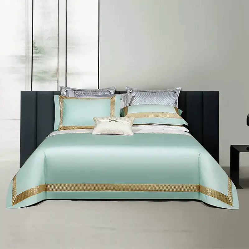 Luxurious mint green satin bedspread with gold embroidery and geometric trim in white and gold egyptian cotton bedding set
