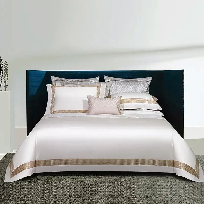 Elegant white satin egyptian cotton bedding set with gold embroidery featuring a gold-toned embroidered border and pillowcases