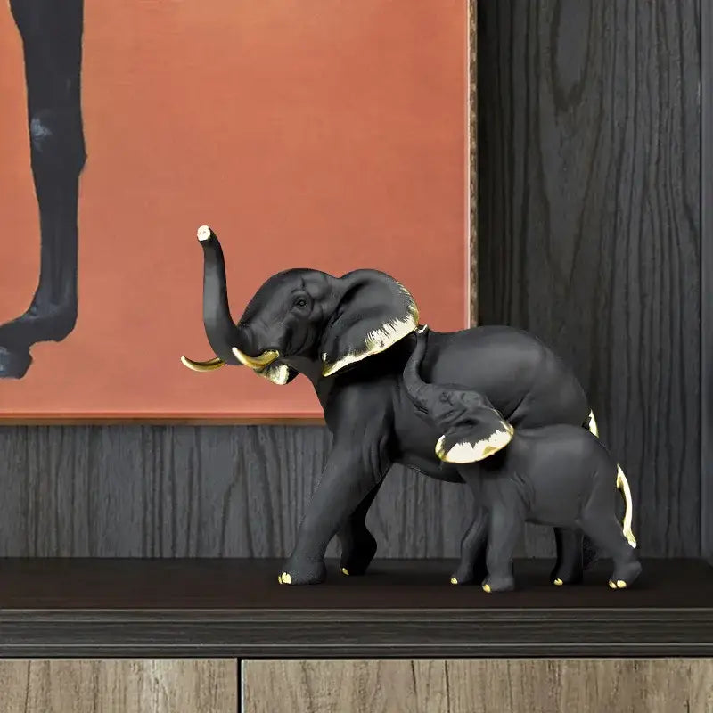 Black decorbites elephant resin sculpture featuring gold-trimmed adult and baby elephants for living room decor