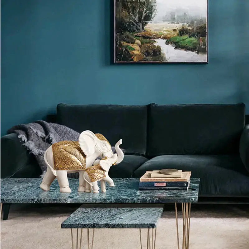 White and gold elephant sculpture figurine with gold leaf detailing and decorative saddle for living room decor