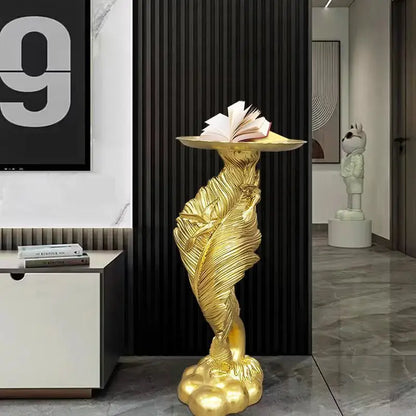 Golden feather floor decoration pedestal with flat top holding open book for white and gold feather floor living room use