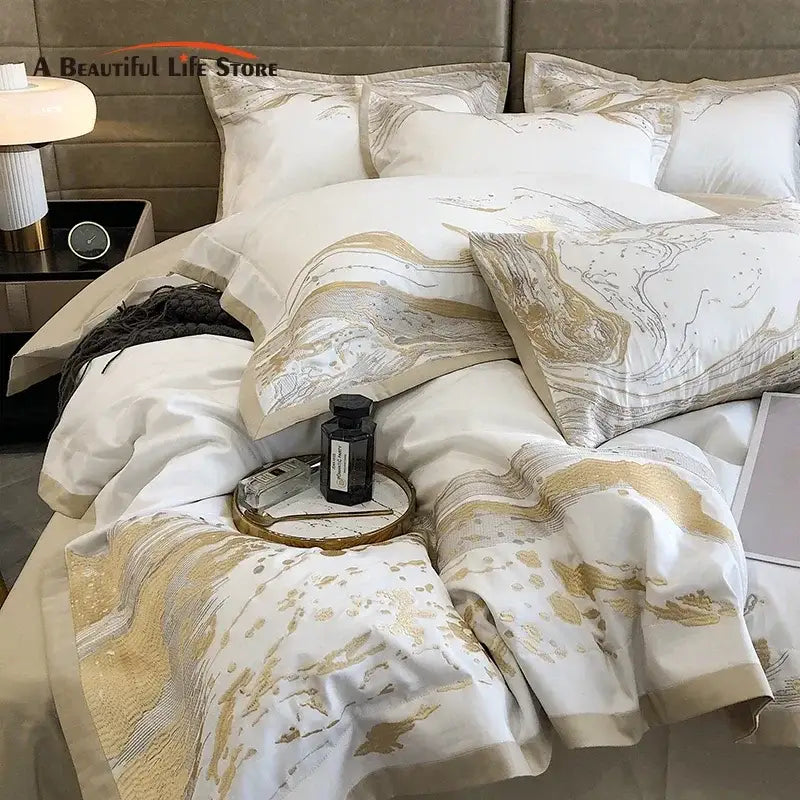 Elegant white and gold marble-patterned satin bedding set with subtle metallic sheen made from egyptian cotton luxury