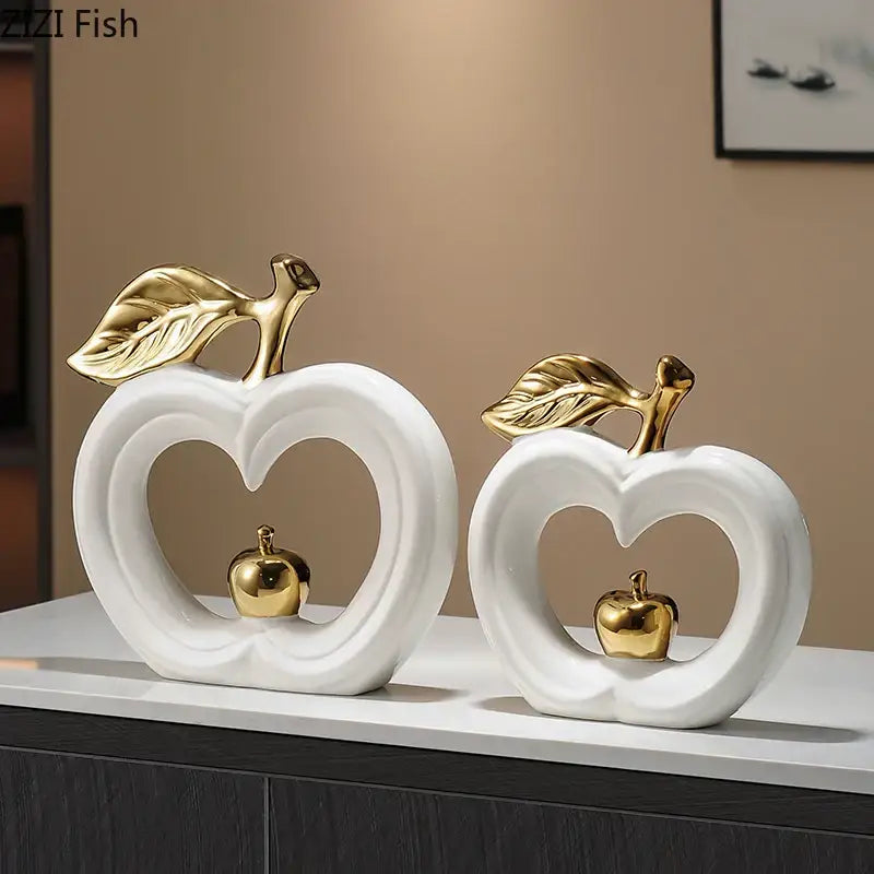 White and gold pear ceramic desk ornament featuring heart-shaped cutouts with miniature golden apples for living room decor