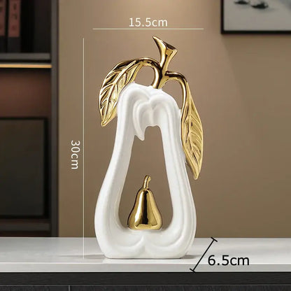 White and gold pear ceramic desk ornament with gold leaf and metallic accent details for living room decorbites decor
