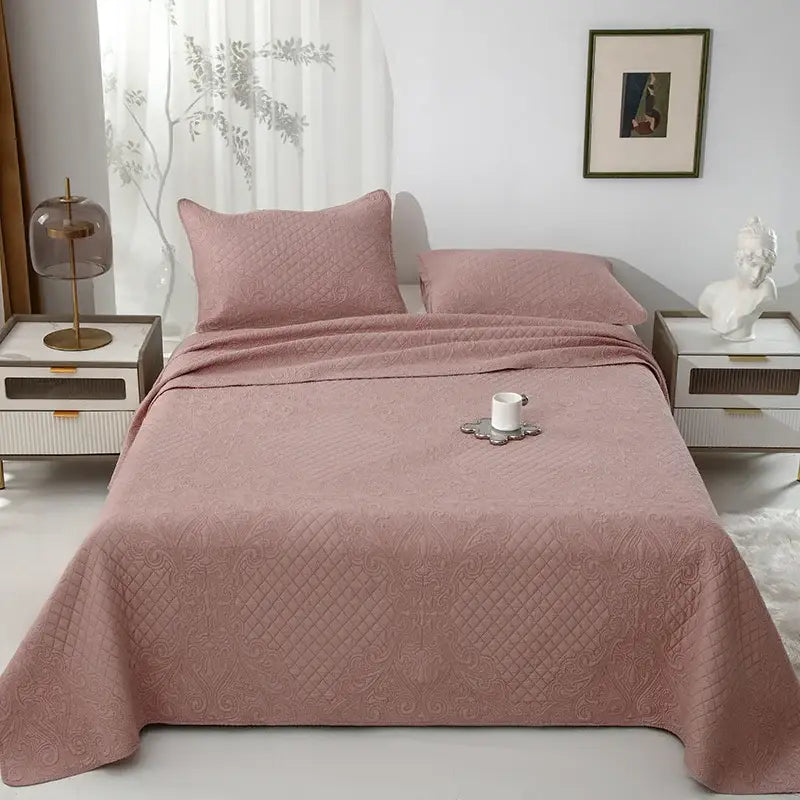 Pink quilted bedspread set with subtle floral pattern and diamond stitching decorbites cotton quilted embroidered