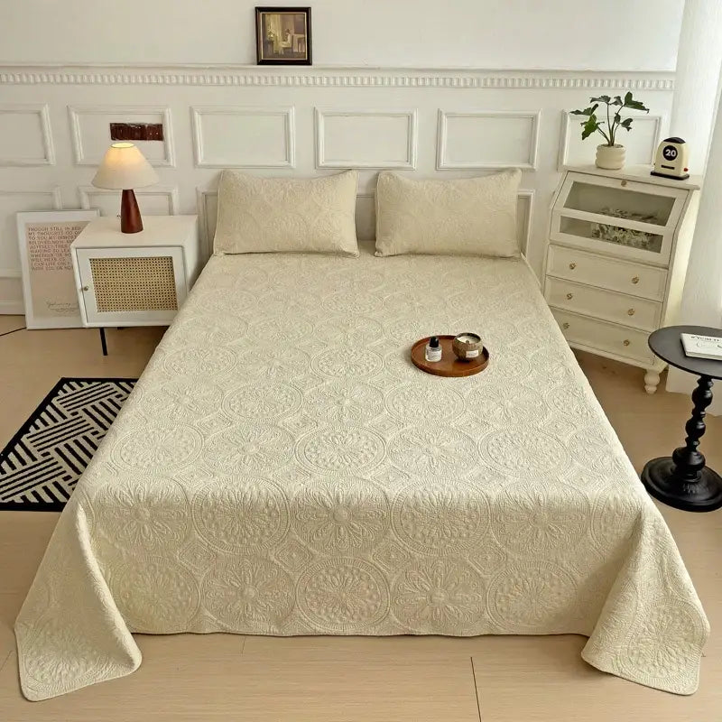 Cream-colored cotton quilted embroidered bedspread set with intricate circular pattern for decorbites bedroom decor