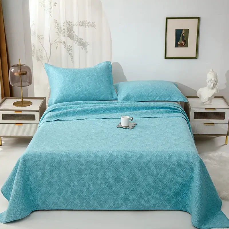 Turquoise cotton quilted embroidered bedspread set with subtle geometric pattern for bedroom decorbites collection