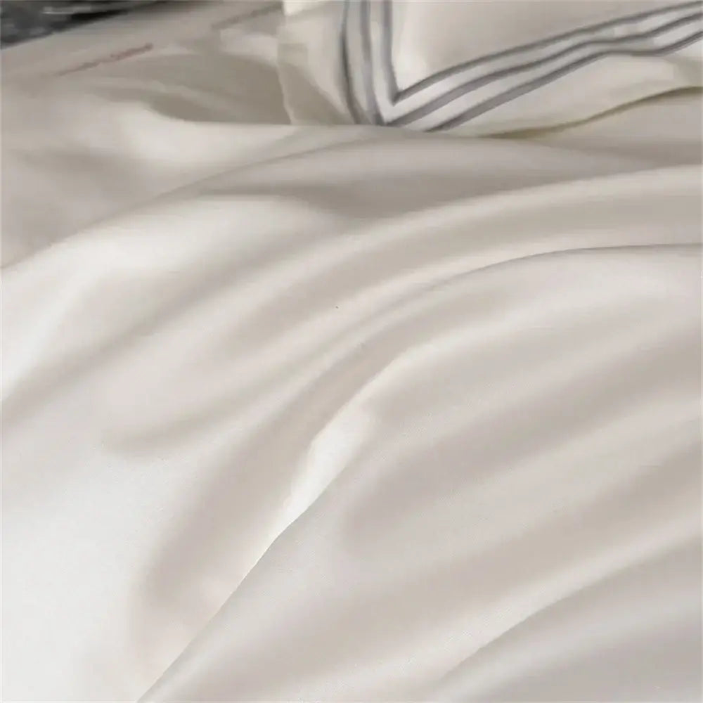 Cream-colored satin sheet with subtle gray striped trim in white and gray egyptian cotton bedding set decorbites 1200tc embroidered