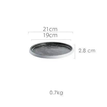 Dark gray ceramic circular tray with metallic rim featuring ice cracked glaze from decorbites crack glazed set