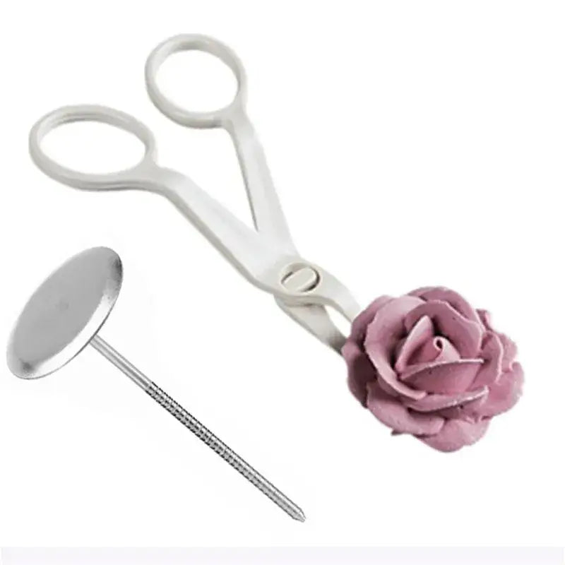 White and pink cream flower scissors set with pink frosting rose attachment and silver icing tip for cake decorating by decorbites