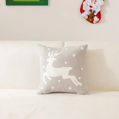 Gray square pillow with white embroidered reindeer and polka dots in decorbites embroidered christmas pillow cases