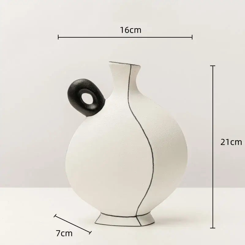White ceramic vase with geometric black lines and a black circular handle for living room decor