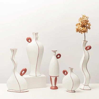 White ceramic vases with terracotta handles and geometric black lines for living room decor