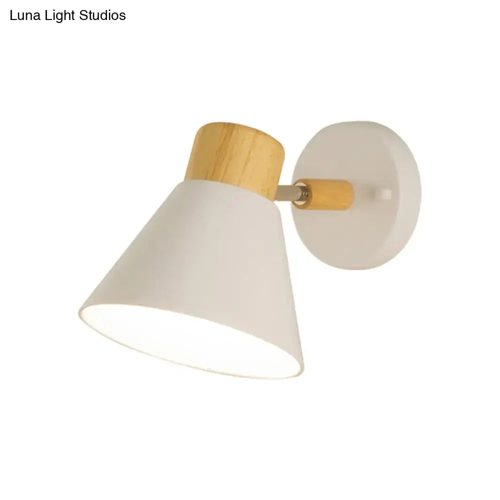 Minimalist white and wood conical wall mount light with matte shade and natural wood accents for bedroom wall lamp