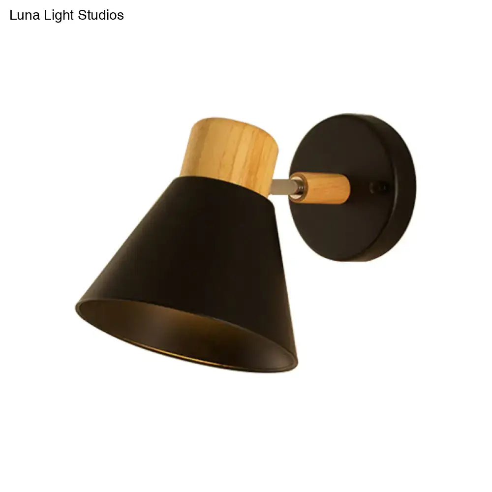 Black matte wall mount light with natural wood accent on top and mounting plate for bedroom wall lamp