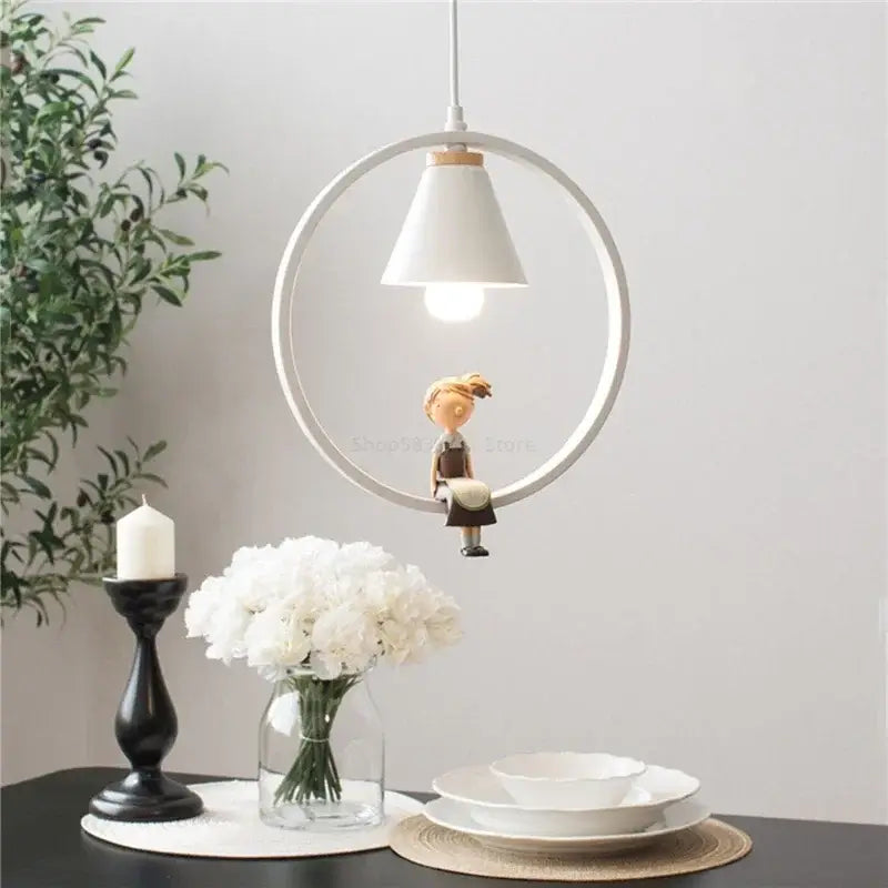 White bird iron ring pendant light features a white circular ceramic iron ring with a girl figurine for bedroom decorbites iron ring pendant lights