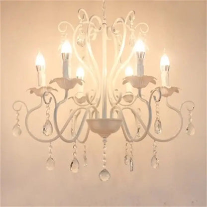 White wrought iron chandelier with crystal pendants and candle-style bulbs for decorbites black white metal decor