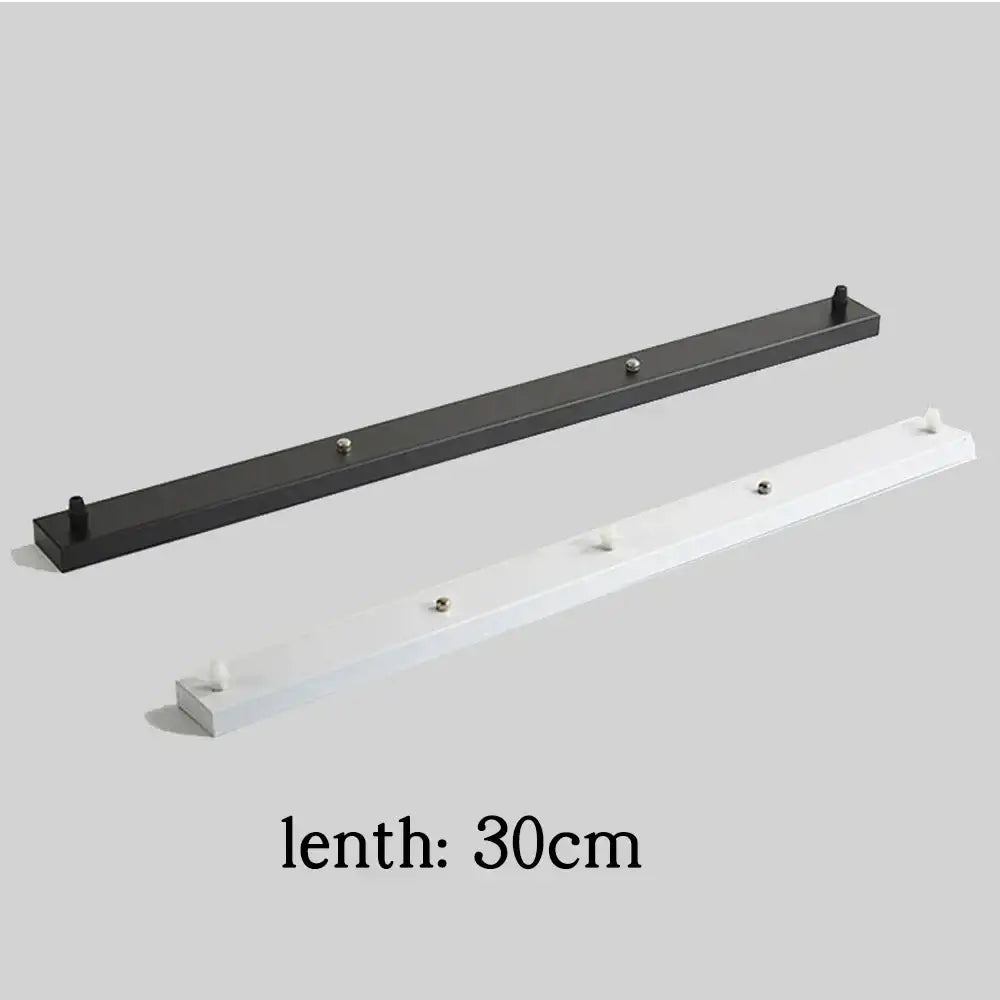 Black and white metal wall-mounted coat racks with hooks paired with white and black decorbites ceiling mount canopy pendant light