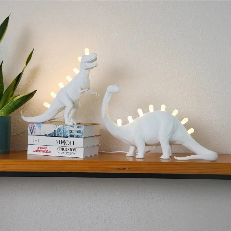 White ceramic dinosaur resin led desk lamp with glowing led lights along its back for bedroom use