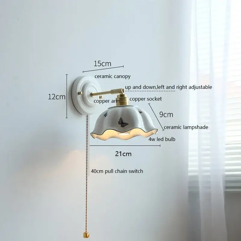 White butterfly ceramic led wall lamp with fluted butterfly-decorated lampshade and brass-finished copper arm