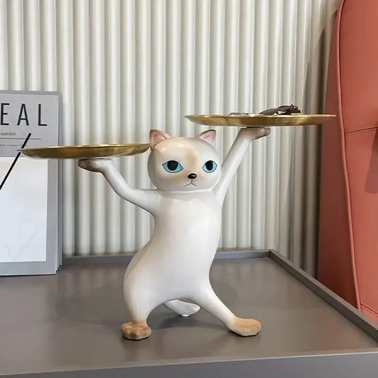 White ceramic cat tray sculpture with blue eyes balancing two gold trays for office desk storage accessory