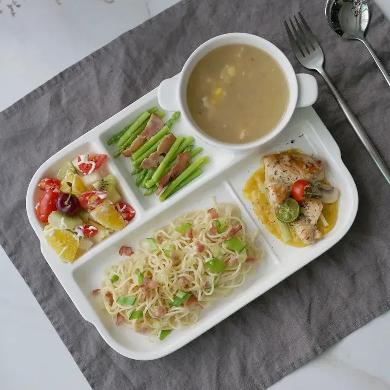 White ceramic decorbites ceramic divided plate with four compartments for organized dining and meal presentation