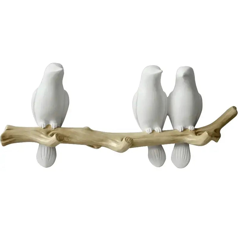 White decorbites bird resin hanger kitchen hook featuring a white ceramic bird figurine set on natural wood branch
