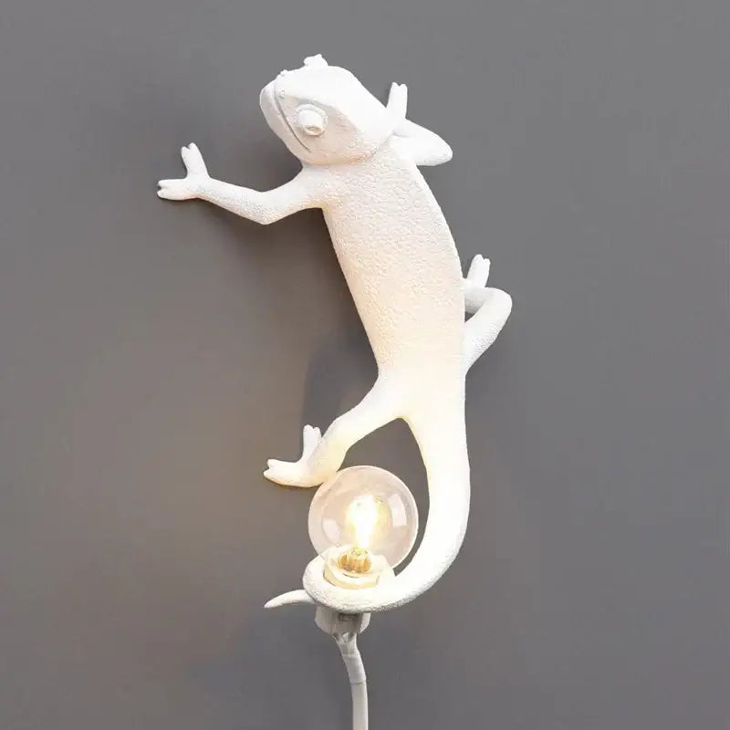 White decorbites chameleon figure resin wall lamp with textured sculpted body and exposed bulb tail for bedroom lighting