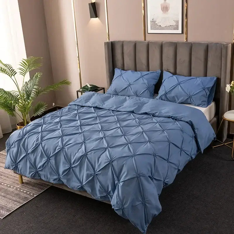 Blue quilted duvet cover set with a diamond pattern featured in the white diamond pinch pleated cover set collection