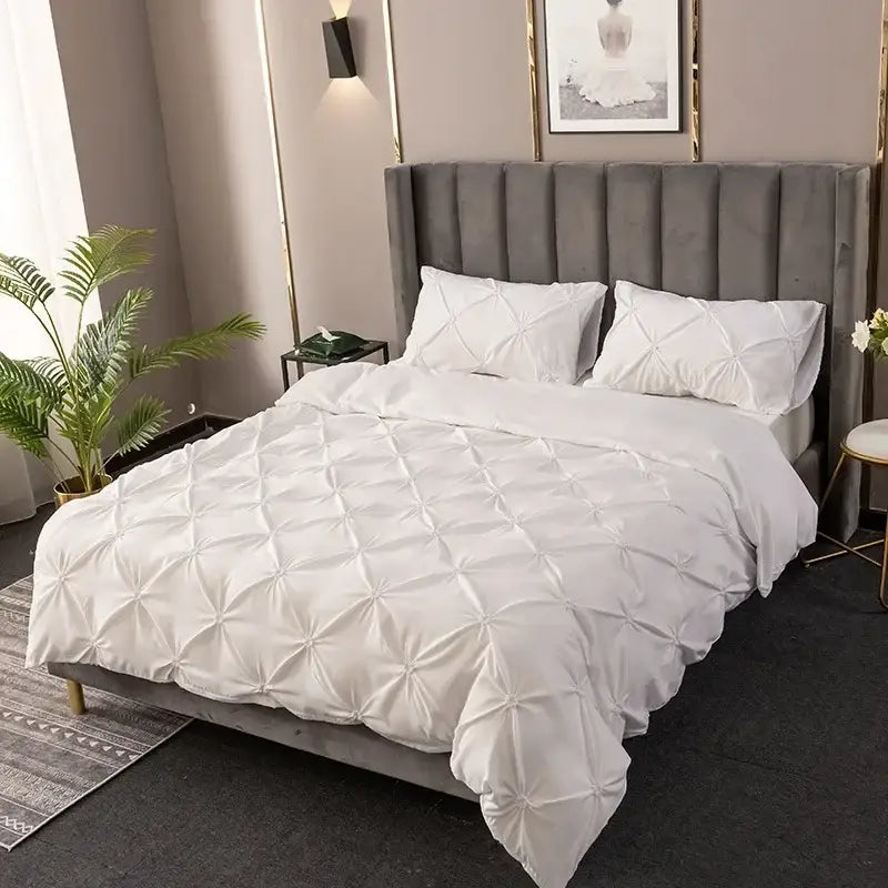 White quilted duvet cover set with soft plush texture and elegant diamond pinch pleated stitching for bedroom bedding