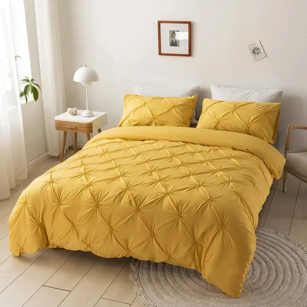 Vibrant mustard-yellow quilted duvet cover set with textured starburst pattern from white diamond pinch pleated collection