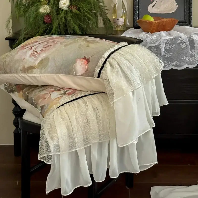 A delicate white double lace ruffles chair cover with floral pillow in egyptian cotton bedding set design