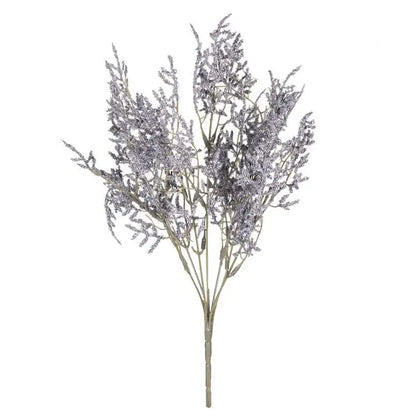 A delicate silver-frosted artificial lavender bouquet with slender stems in a white dried baby’s breath lavender vase