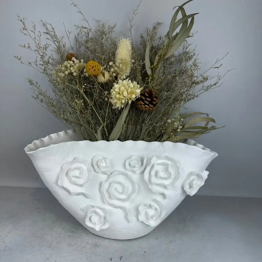 White embossed rose ceramic vase with scalloped rim holding dried botanicals decorbites embossed rose decor