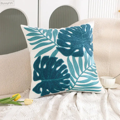White cushion pillow case with teal embroidered tropical leaf pattern for decorbites cactus lemon living room decor